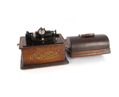 An Edison standard phonograph, in oak carrying case, two metal horns and a quantity of wax cylinder discs 