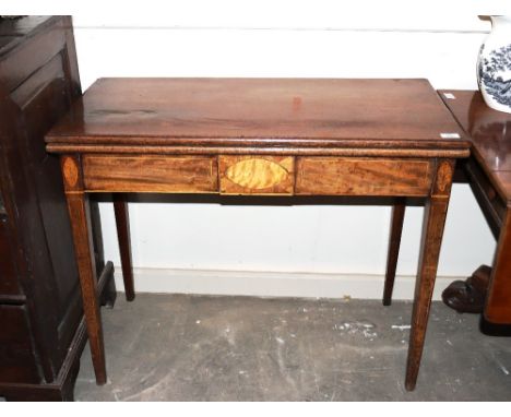 A 19th Century mahogany and satin wood inlaid fold over card table, raised on square tapering supports, 92cm wide&nbsp;