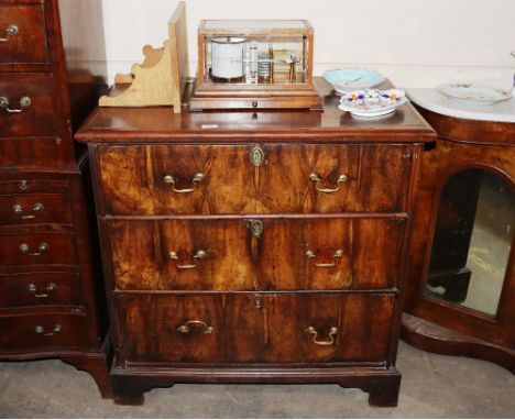 An 18th Century walnut chest, fitted three long drawers raised on bracket feet, 87cm wide x 54cm deep x 90cm high&nbsp;