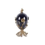 A blue glazed pottery and bronze jar and cover in the Rococo style, decorated flowers heads and