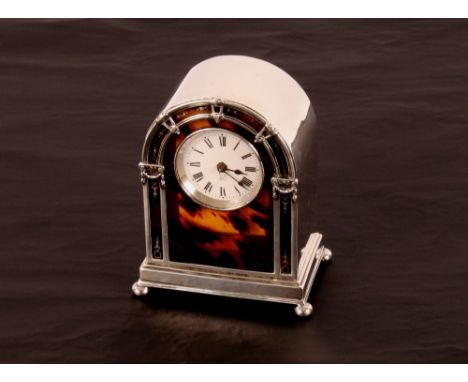 A silver and tortoiseshell mantel clock, by Elkington & Co. of arched form with ball feet, London 1920, 15cm high 