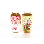 Two floral decorated Minton baluster vases, the shoulders heightened in gilt, 18cm high