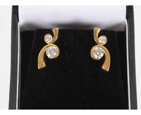A pair of impressive 18ct gold and diamond set ear-rings, each ear-ring with two brilliant cut diamonds mounted in yellow gol
