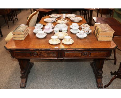 A 19th Century pollard oak two drawer library table, by H. Ogden, Manchester, fitted two frieze drawers raised on shaped end 