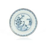 A London Delftware plate, the central field decorated with a bird in landscape, stylised flowers