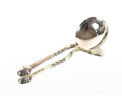A modern silver caddy spoon with acorn terminal, Hallmarked for London 1993, makers mark N.T.E.
