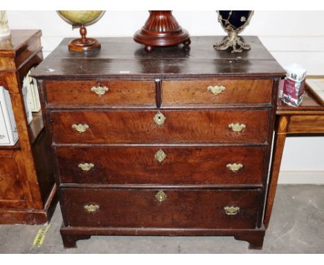 An 18th Century oak chest, of two short and three long graduated drawers raised on bracket feet 102cm x 57cm