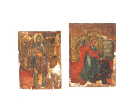 A rare 16th Century Greek icon, painted on panel depicting a female saint with fierce mythological beast, indistinct inscript