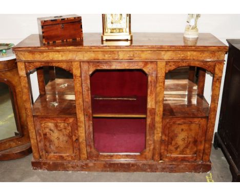 A Victorian burr walnut and satin wood inlaid side cabinet, interior fabric lined shelves enclosed by a glazed panel door, fl