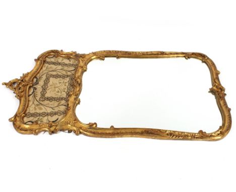 A pair of 19th Century impressive carved gilt wood wall mirrors of shaped rectangular form, surmounted by a pierced scroll, t