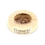 An unusual 1920's pressed glass "Bonzo" inkwell; and a Wiltshaw & Robinson "Guinness" advertising