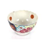 A Chinese tea bowl, with tobacco leaf decoration; an Oriental saucer dish; a Newhall similar; a