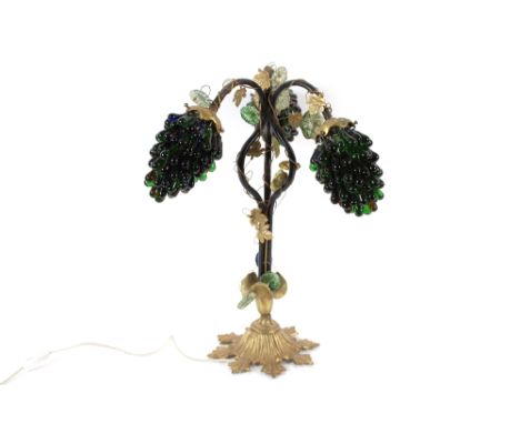 A table lamp decorated with coloured grape cluster lampshades in the Murano style, raised on gilded foliate base, 54cm high&n
