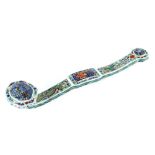 A Chinese porcelain Ruyi sceptre with dragon and phoenix decoration, 49.6cm long