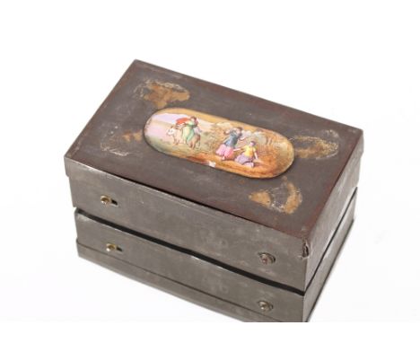 An early Victorian tin musical snuff box, the lid decorated with an enamel panel