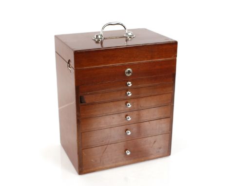 A 20th Century mahogany cased dentist's cabinet, fitted lifting top compartment and six drawers under, and contents of variou