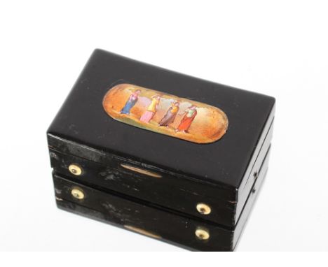 A 19th Century tortoiseshell musical snuff box, with sectional comb, the lid decorated with an enamel panel, 9.3cm long