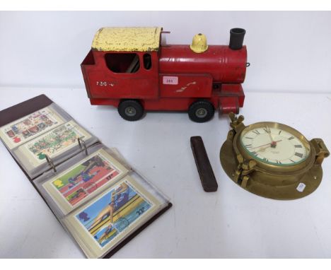 A lot to include a Triang tin plate puff - puff pull along model locomotive, a nautical quartz wall clock, the frame in the f