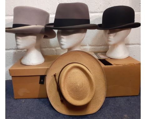 Four gents hats comprising a late 20th Century Windmill Textiles grey felt top hat with black band size 7⅜, a mid 20th Centur