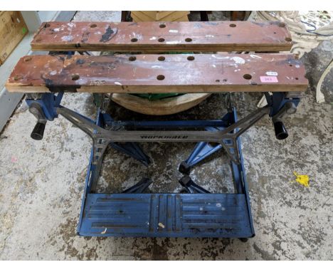 A Black and Decker Workmate bench, and a wooden trunk containing a Black and Decker drill, and various tool power packs Locat