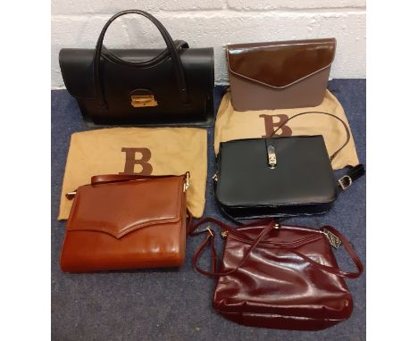 A group of mid to late 20th Century bags, mainly leather, to include a brown Bally clutch bag with branded dust-bag, a black 