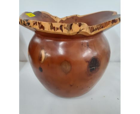 A Terry Harvey hand turned yew planter dated 1996 with label and carved insignia to the base, 27cm High x 18cm internal diame