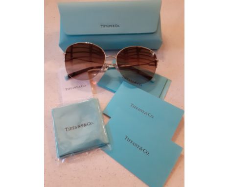 Tiffany-A pair of gold tone half framed sunglasses having brown ombre lenses, model no: TF3082 with branded turquoise case, c