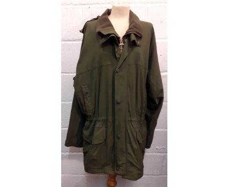 Barbour-A green breathable rain jacket with detachable hood, having a green fleece collar, a green Barbour tartan lining, a d