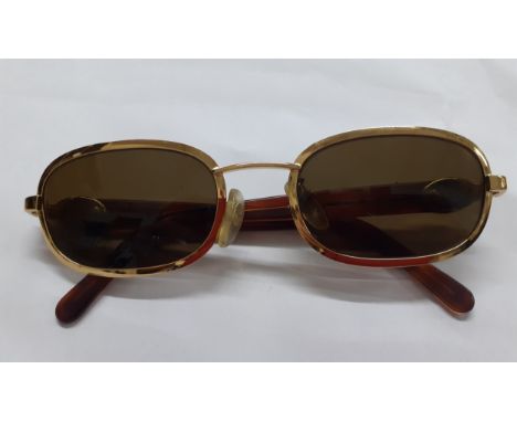 Rochas-A pair of vintage gold tone sunglasses, model 90778 with green lenses and tortoiseshell effect stems together with a v