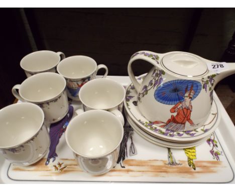A Villeroy and Boch Art Deco style coffee service comprising 6 mugs, 6 side plates, tea pot and a tray decorated with Art Dec