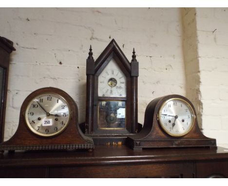 A collection of 3 clocks, 2 1930's oak cased mantle clocks and an American shelf clock