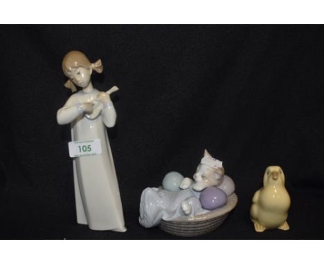 A modern Lladro figure study of a girl playing lute having damage to head, and two Nao figures one of a chick and one of a ca