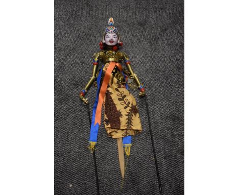 A vintage Indonesian Wayang Golek rod puppet or marionette