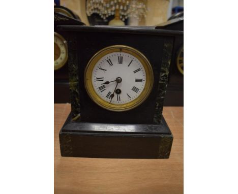 A Victorian French slate mantel clock with marble inserts and enamel dial