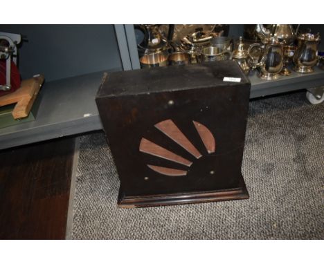 An Art Deco speaker and cabinet with a star burst design.