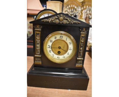 A Victorian Slate mantel clock with brass decals, and enamel dial