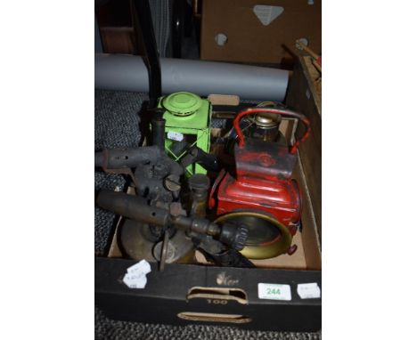 An early 20th century Lucas cycle or motor car lamp, two gas torches and Windermere tea can