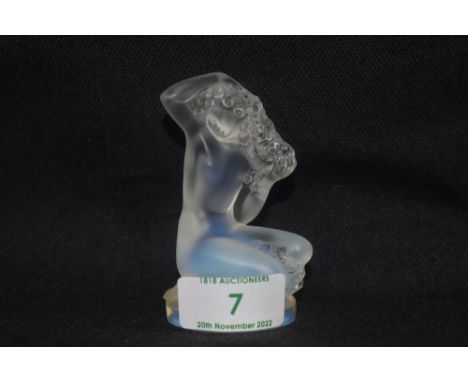 A modern art glass Lalique study of a nude female seated titled Floreal in opalescent glass signed Lalique France 9cm tall
ve