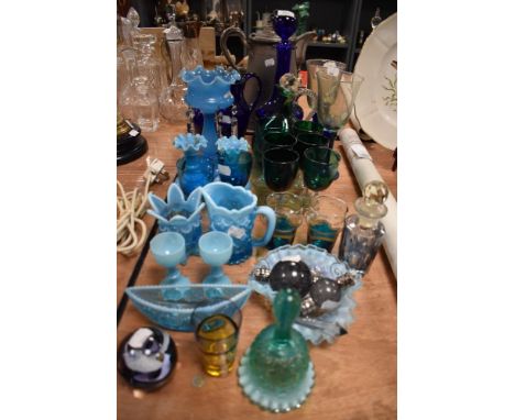A selection of early 20th century glass wares including blue custard glass, Bristol blue and jade green decanter and glass se