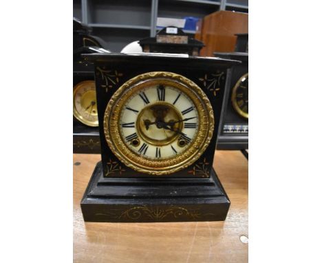 A Victorian cast iron mantel clock by the Ansonia American clock co,