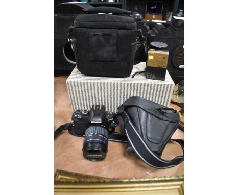 An Olympus E-410 digital camera with two lens and camera bag