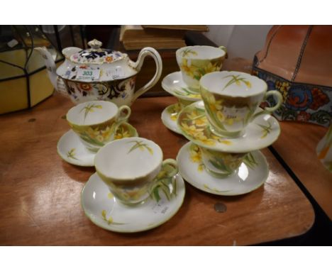 An early 20th century Shelley Foley imari pattern tea pot with six Shelley Daffodil tea cups and saucers