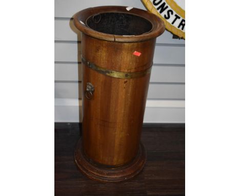 A Victorian stick or umbrella stand in coopered mahogany with brass banding and lions head handles with metal liner.
Rim is l