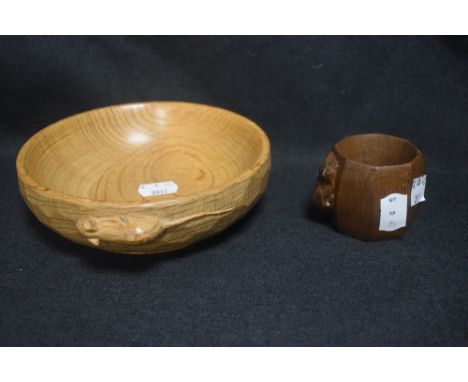 A Robert Thompson Mouseman Yorkshire Oak carved Nut Bowl with a Napkin ring, both bearing a carved mouse signature. Bowl meas