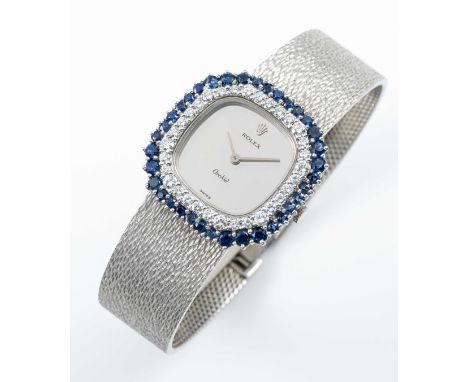A FINE LADIES 18K SOLID WHITE GOLD, DIAMOND & SAPPHIRE ROLEX ORCHID BRACELET WATCHCIRCA 1973, REF. 3379 WITH MIRROR DIALMovem