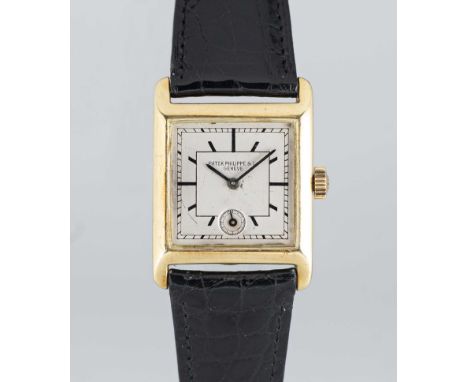 A GENTLEMAN'S 18K SOLID GOLD PATEK PHILIPPE WRIST WATCHCIRCA 1930, WITH SECTOR DIALMovement: Manual wind, signed Patek Philip