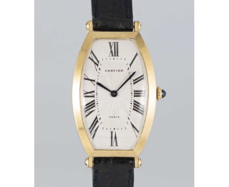A GENTLEMAN'S 18K SOLID GOLD CARTIER PARIS CINTREE TONNEAU WRIST WATCHCIRCA 1990sMovement: Manual wind, signed Cartier.Case: 