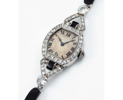A FINE & RARE LADIES PLATINUM, DIAMOND & ONYX CARTIER COCKTAIL BRACELET WATCHCIRCA 1920s, WITH MATCHING NUMBERS ON THE CASE &