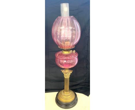 Victorian Nelsons column brass oil lamp with funnel, pink shade and font, approximate overall height: 28.5 inches,  diameter 