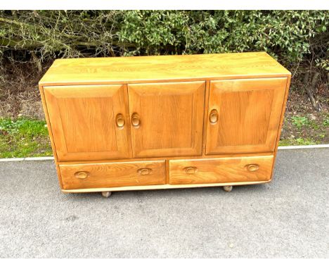 Vintage Ercol 3 door, 2 drawer sideboard, approximate measurements: Height 30 inches, Width 50.5 inches, Depth 18 inches, Sid